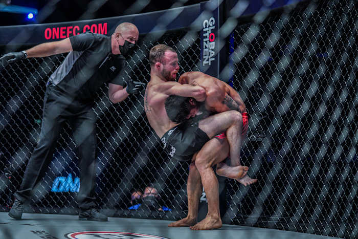 Jarred Brooks puts his opponent in a headlock